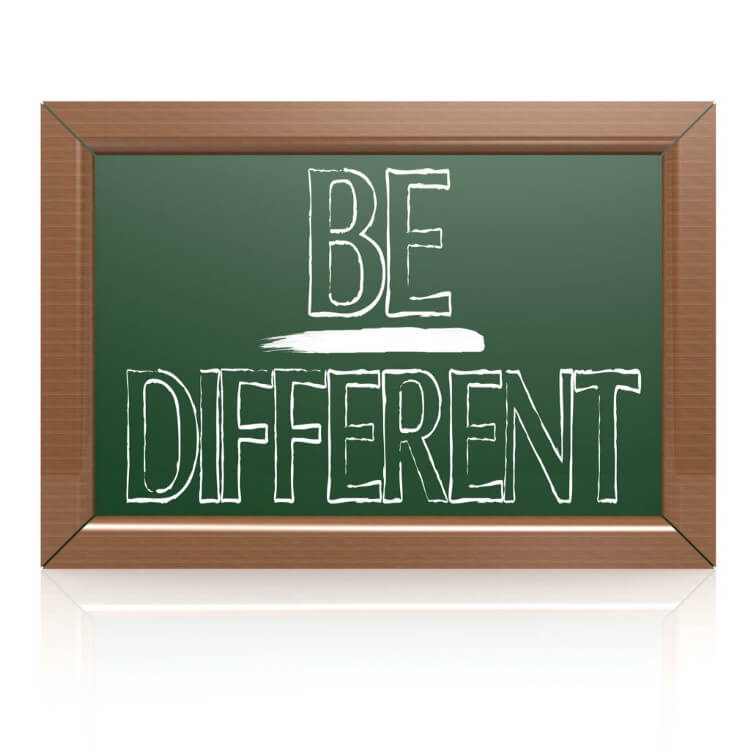 Chalkboard with the phrase "Be Different" emphasizing unique business strategies for entrepreneurs.