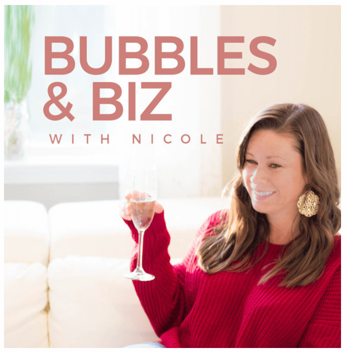 Bubbles and Biz podcast cover featuring Nicole holding a champagne glass, smiling, in a cozy setting with soft lighting.