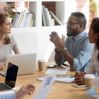 diverse group of professionals discussing a project