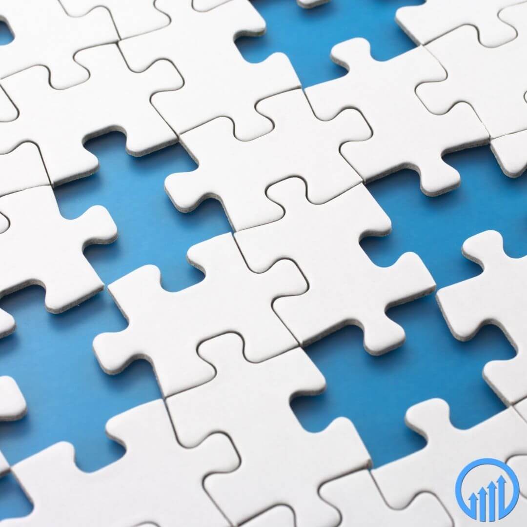 White puzzle pieces partially assembled on a blue background