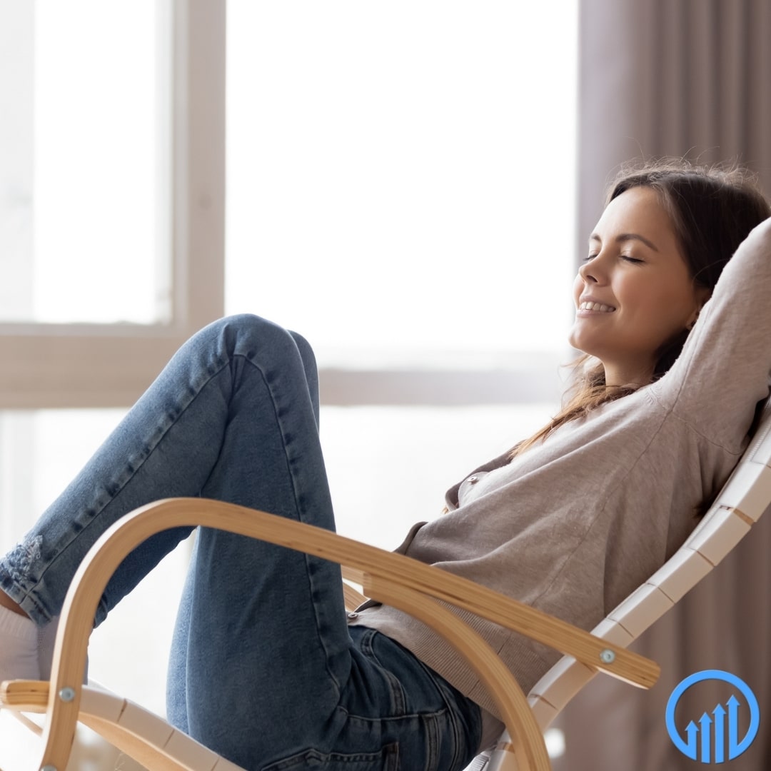 woman resting in a rocking chair and smiling