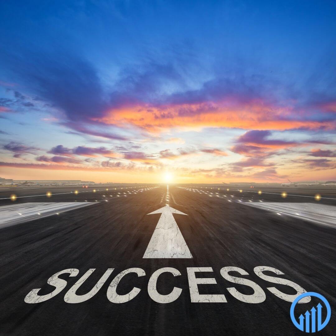 Road leading to sunset with "SUCCESS" painted on it, symbolizing business growth and new opportunities.