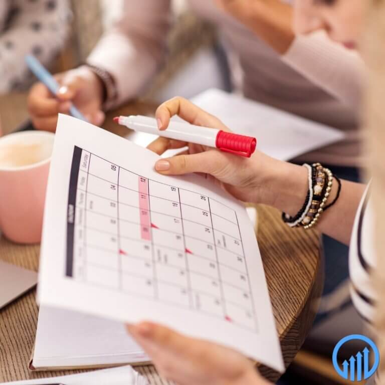 a team of professionals working on a business calendar