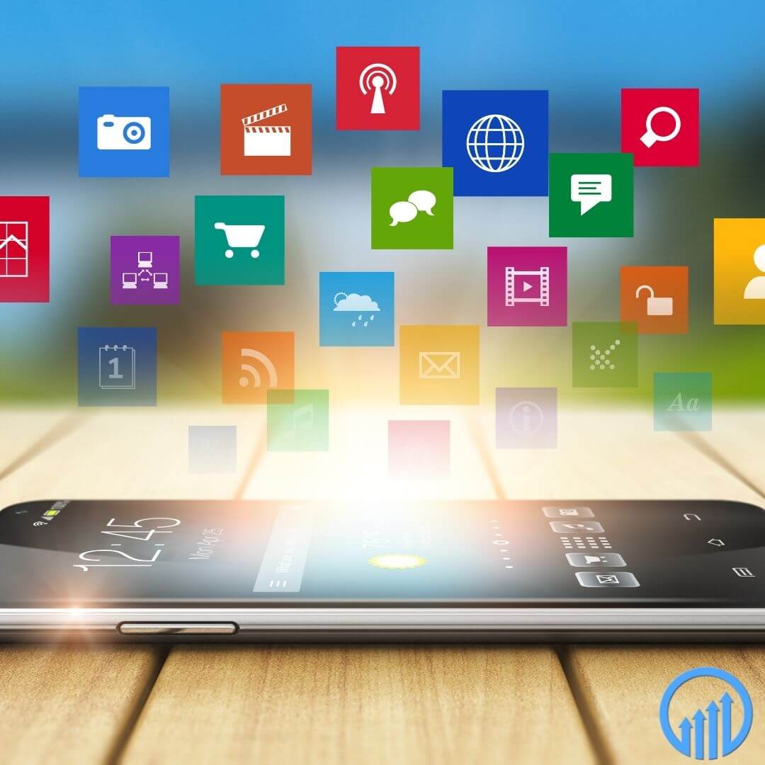 a smartphone on a table with marketing icons floating above it