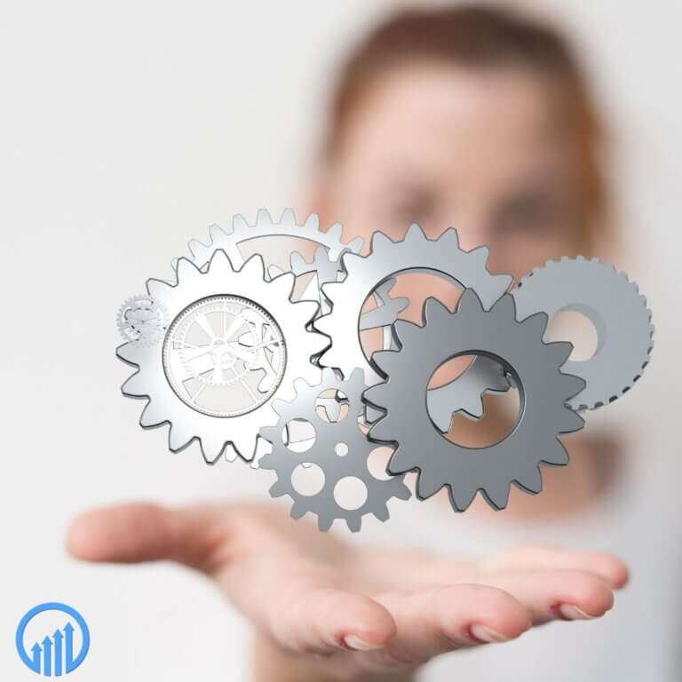 A woman holding her hand out with gears floating above it
