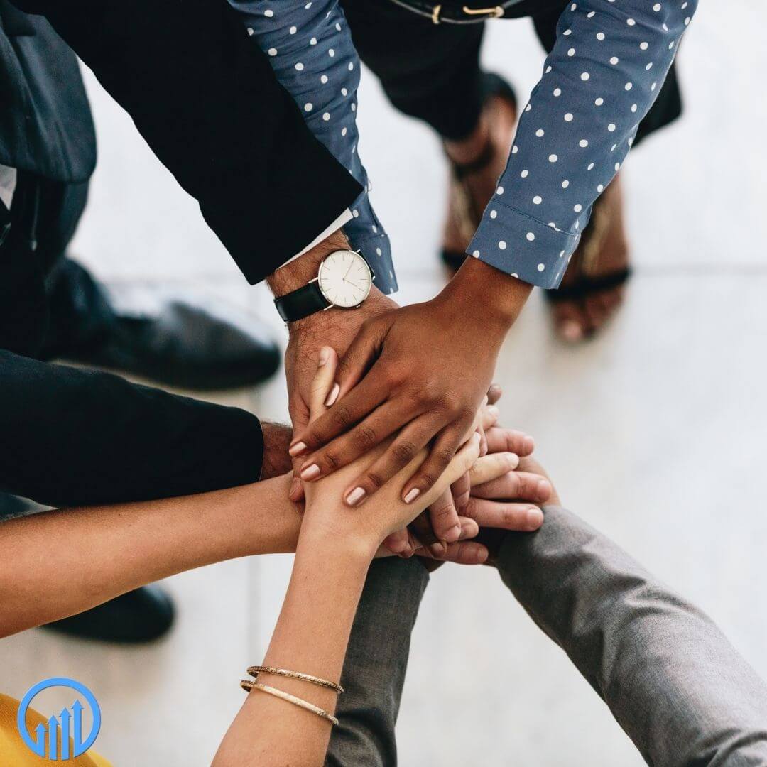 Diverse hands meeting in the middle