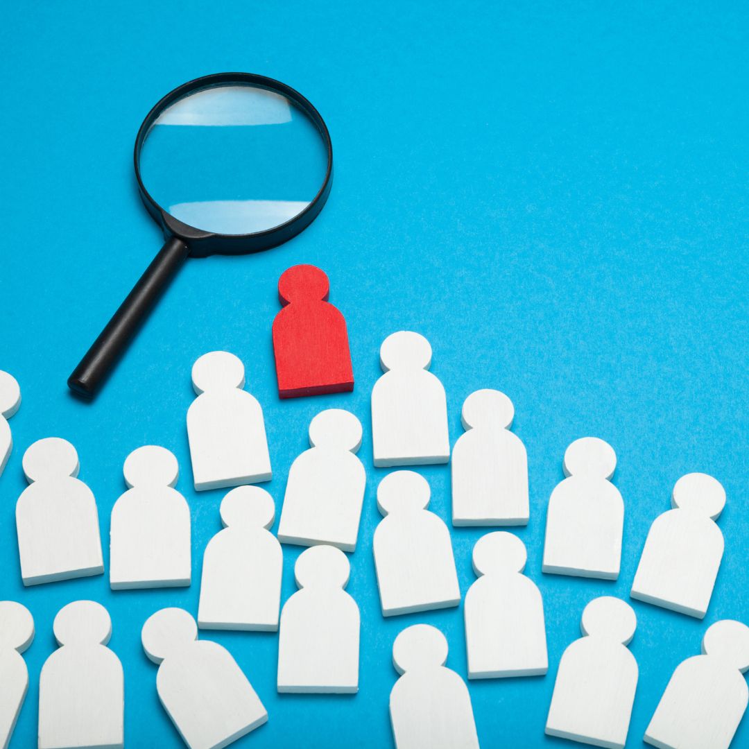group of white icons and one red icon on a blue background