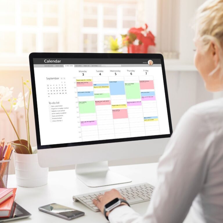 woman working on her calendar on her computer