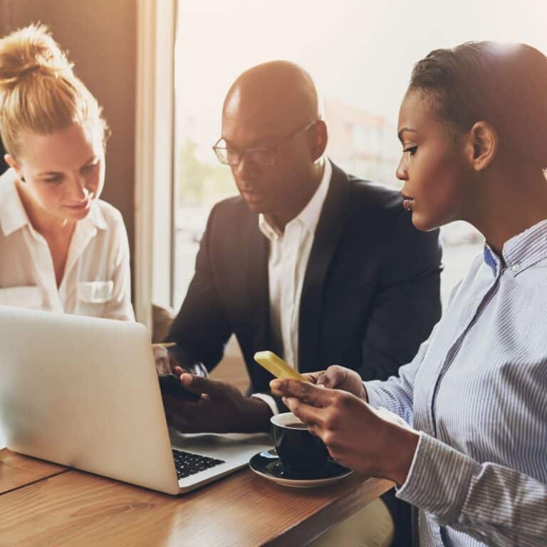 small office team working around a laptop