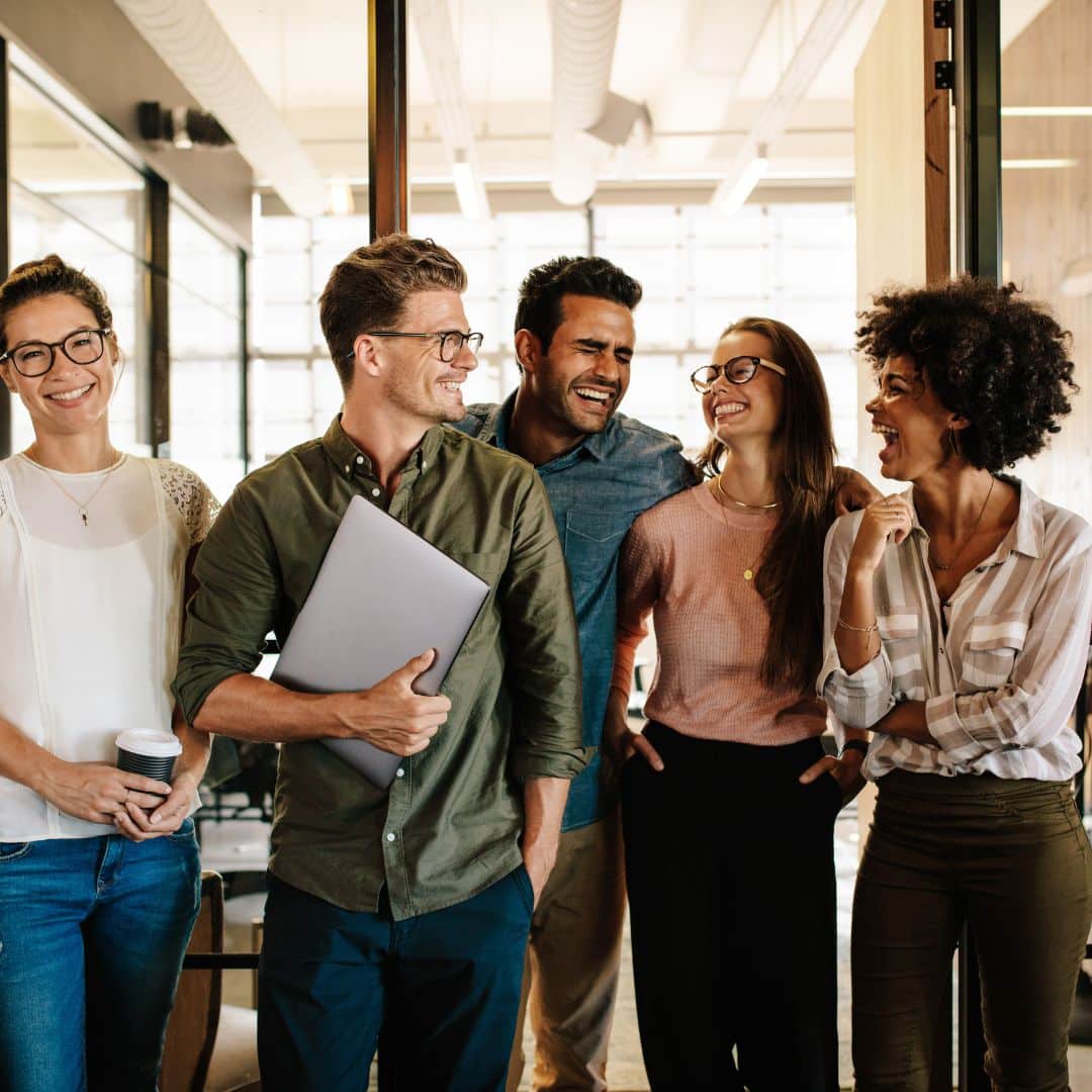 Diverse small business team standing together and smiling