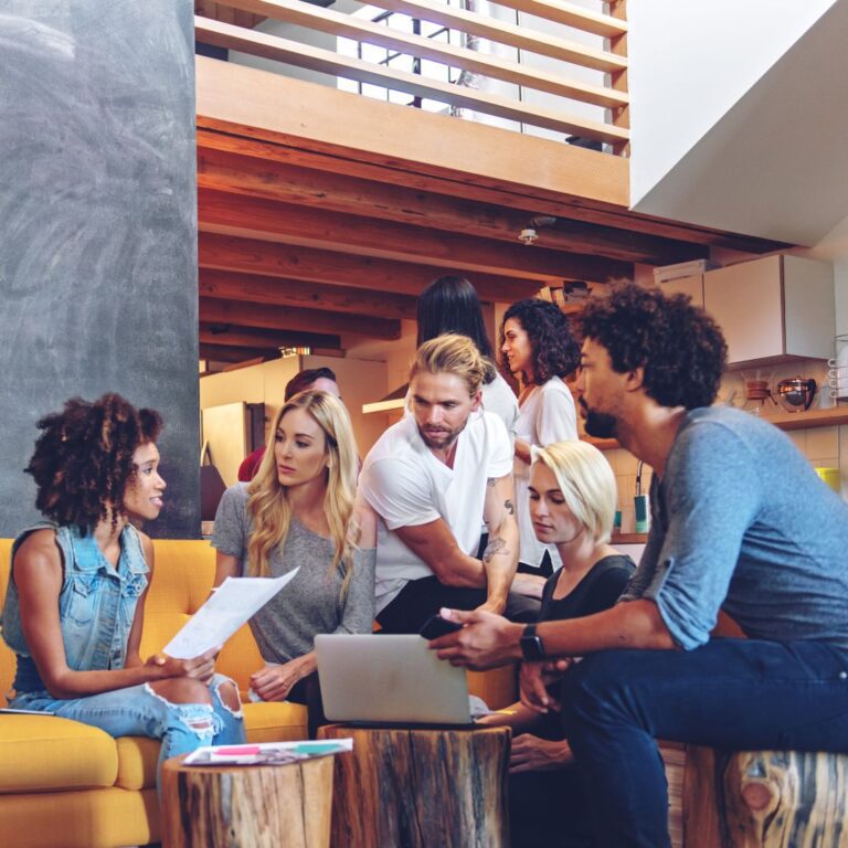 A diverse small business team working together to plan a project