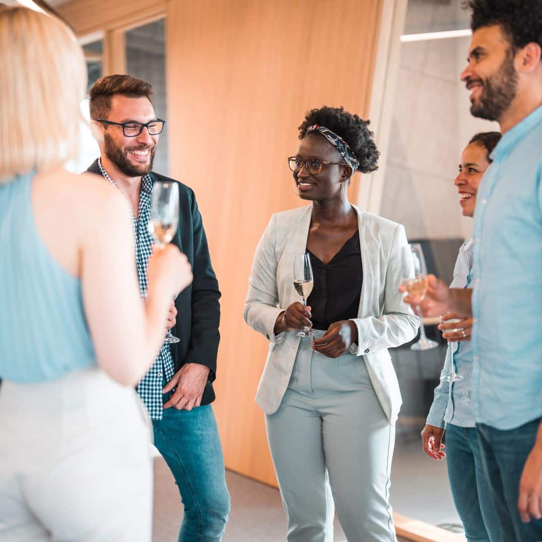 An office team celebrating an event with champagne
