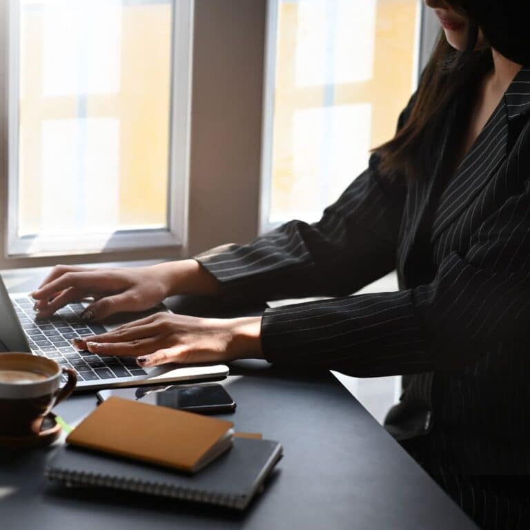 An executive assistant working at her laptop
