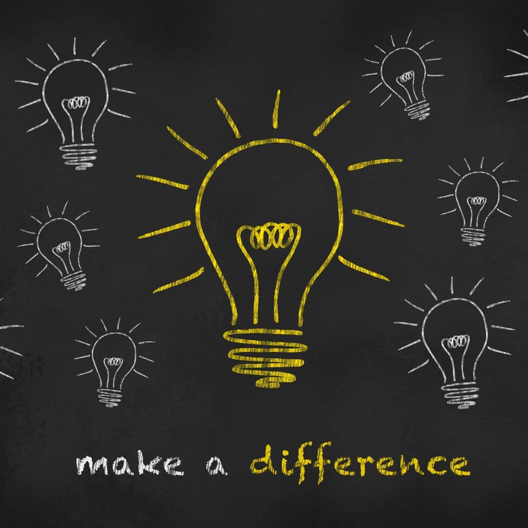 Light bulbs drawn on a chalkboard with the words "make a difference"