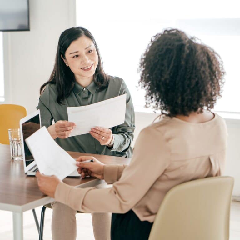 A hiring manager and new candidate in an interview.