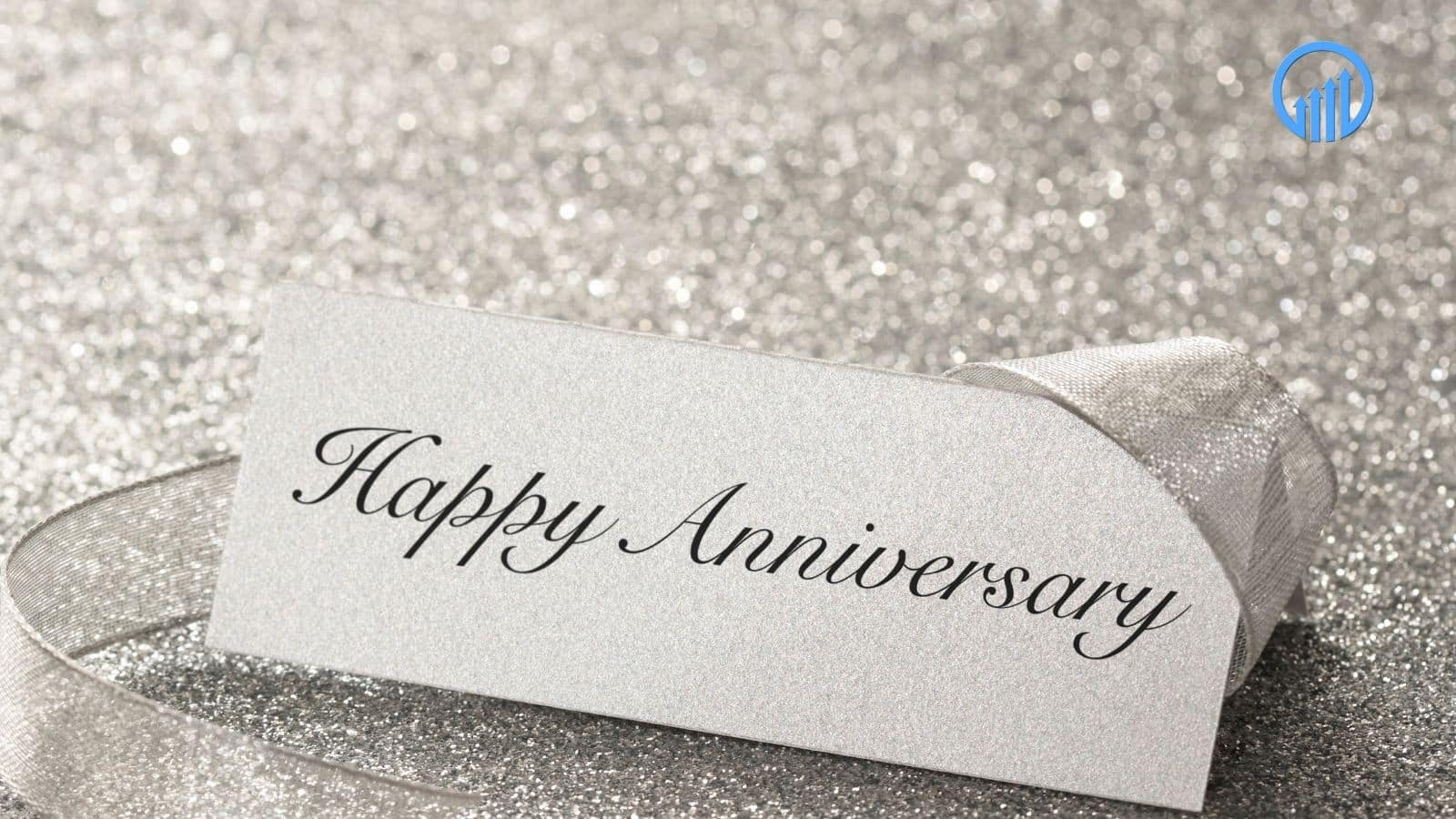 Happy Anniversary card on a sparkling silver background, symbolizing business milestones and celebrations.